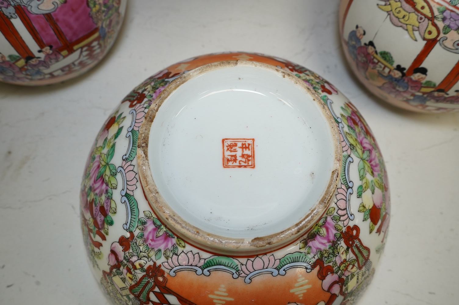 A 20th century Chinese famille rose bowl and a pair of jars and covers, bowl 26cm diameter. Condition - good